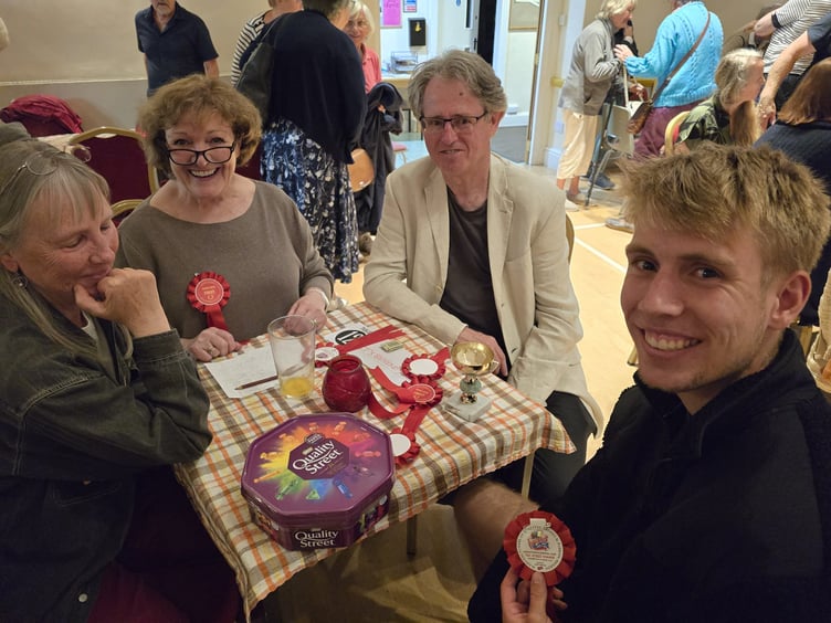 Prize winners compare rosettes