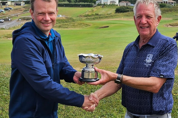 Graham Cup winner Chris Watt receives his prize from club captain John Rogers