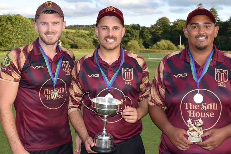 Stoke Gabriel's Corinthian Cup-winning captain Jack Tolley (centre) pictured with Mike Meach (left), who hit the winning runs in the last over, and man of the match Justin Pringle (right)
