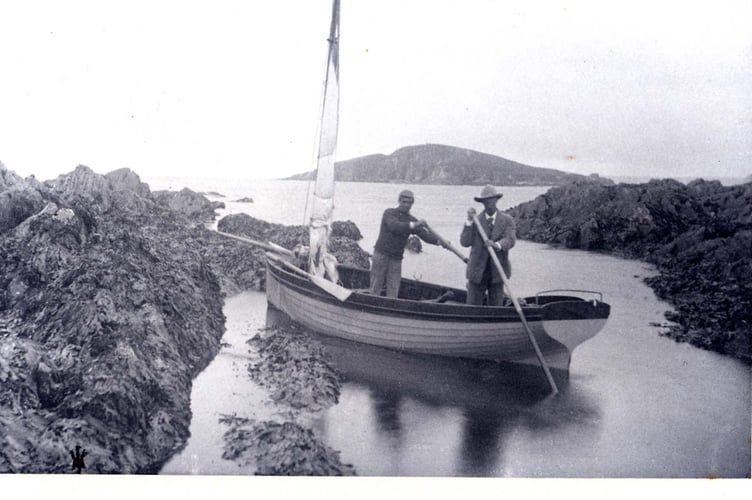 On the coast near Bantham, two men in a small boat
