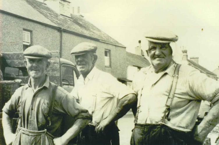 Beesands -Three men, all wearing braces and flat caps. 