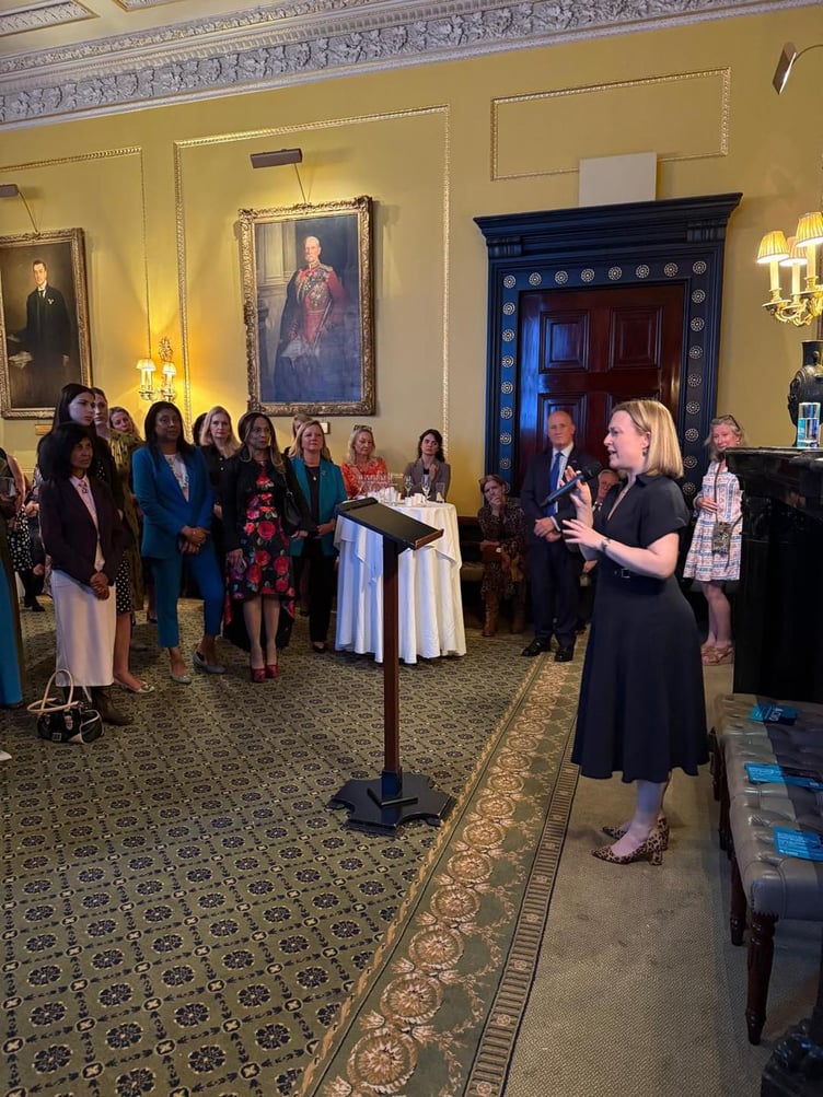 Rebecca Smith MP addresses a group of mainly women