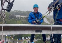 Leap of faith in appalling weather as fundraisers abseil off Derriford