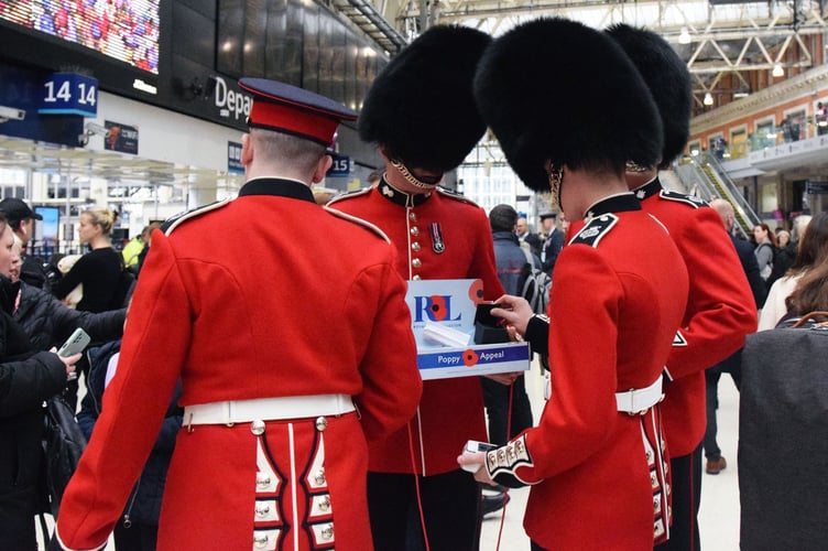 Grenadier Guards collecting at Waterloo on London Poppy Day.