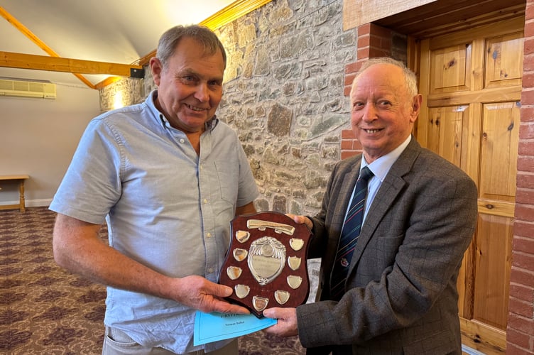 Norman Bulled won the Devon Classic Ploughing trophy, presented by President Raymond Govier. AQ 7127