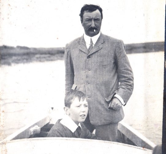 Sidney Dent & son Stanley in stern of small yacht