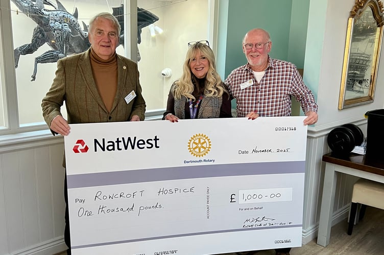 Debbi is pictured receiving the £1,000 cheque on behalf of Rowcroft from Dartmouth Rotary Club President Peter Goldstraw (left) and Rotarian and summer fete organiser Keith Barker.