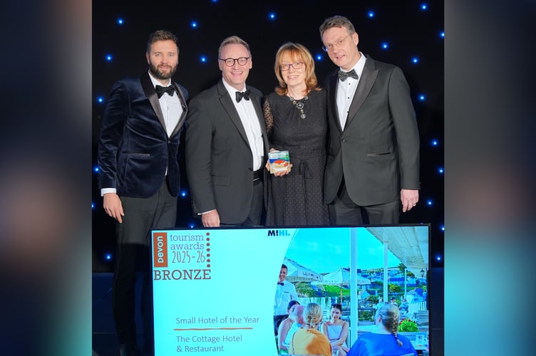 Cottage Hotel, Hope Cove, receive Bronze at Devon Tourism Awards. L-R: Award Sponsor, Booking.com. Hotel General Manager, Neil Slade and Directors Sarah and William Ireland.
