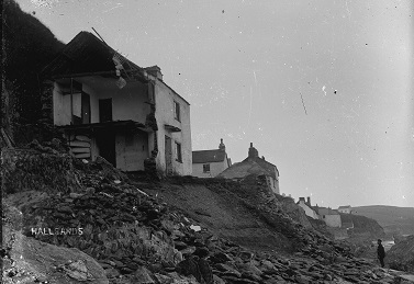Hallsands houses partially demolished at south end of of village, viewed from beach