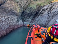 Dartmouth RNLI lifeboat crews in hide and seek training near rocks