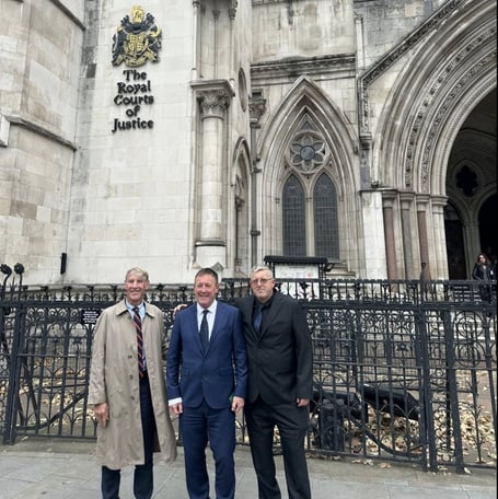 Neil Stevens (centre) with Rob Sheridan (left) and brother Tony Stevens outside the High Court (Image courtesy: Neil Stevens/Facebook).