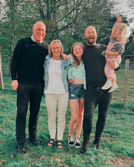 Lyn Goss pictured left with wife Sue and family