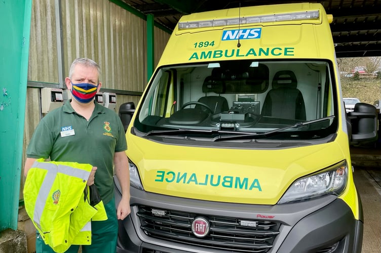 Gary beside an ambulance
