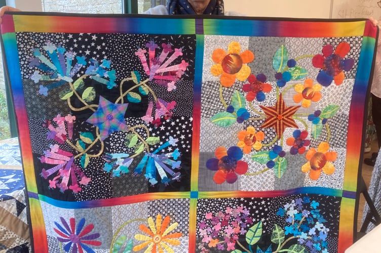 Sue McLeod- Machine-pierced quilt applique
