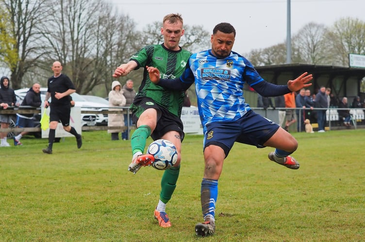 Ivybridge's Chris Harvey competes for the ball against Buckland's Myles James