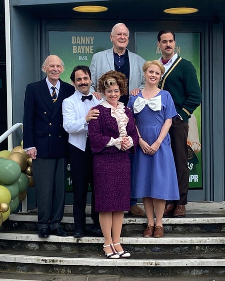 The cast of Fawlty Towers - The Play outside Princess Theatre on opening night. (Back L-R: John Cleese and Danny Bayne. Front L-R: Paul Nicholas, Hemi Yeroham, Mia Austin and Joanne Clifton).