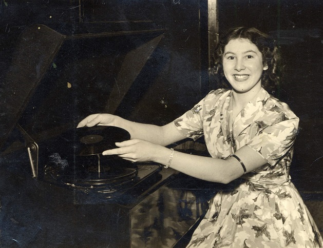 Margery Farr playing a gramophone record