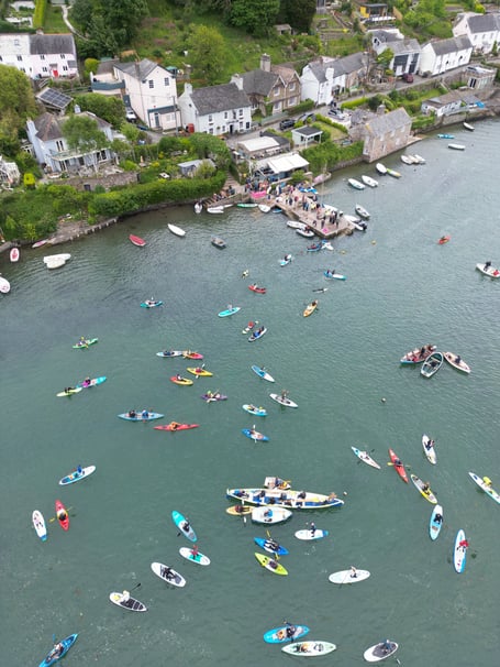 Paddle Out Protest 2026 at Noss Mayo, part of a Surfers Against Sewage national campaign.