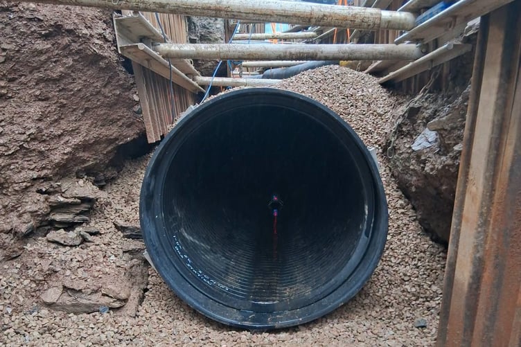 Newly installed pipework carefully maneuvered into place.