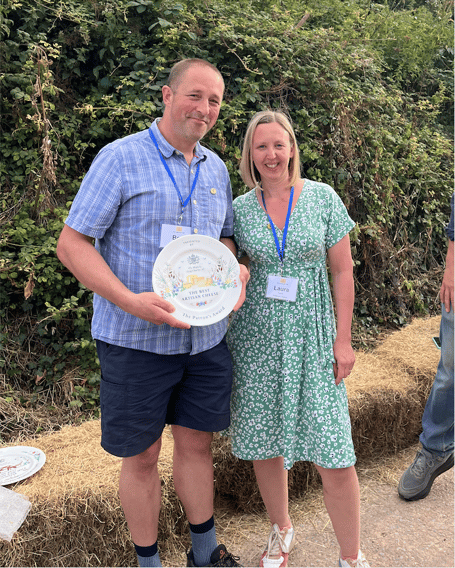 Ben and Laura Harris from Ticklemore Cheese Ltd after being presented with The Patron’s Award for the Best Artisan Cheese of the Year 2026.