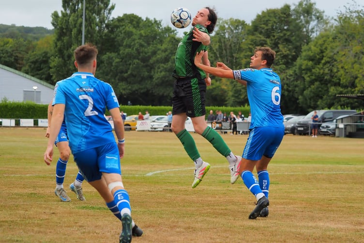 Josh Johnson rises highest to control the ball