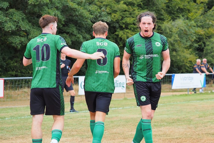 Josh Johnson celebrates one of his two goals against Torpoint