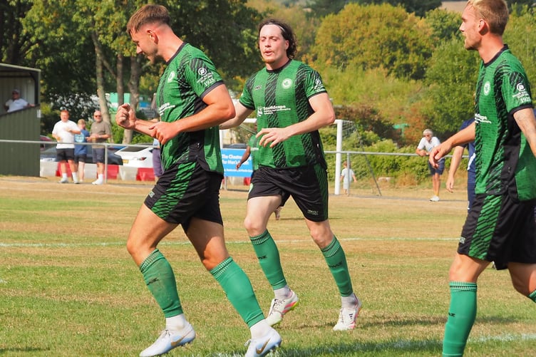 Dan Tate celebrates after scoring the winner against Teignmouth