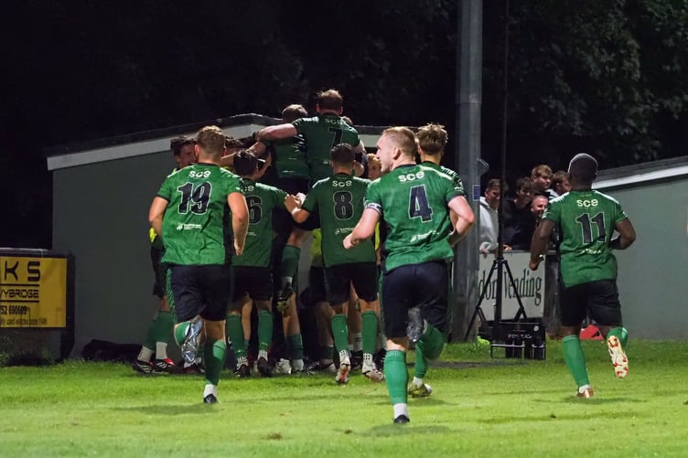 Ivybridge Town players celebrate their dramatic comeback