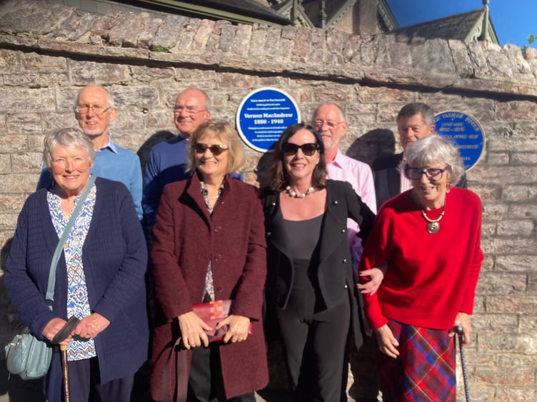 Members of the MacAndrew family gather for the unveiling of the plaque