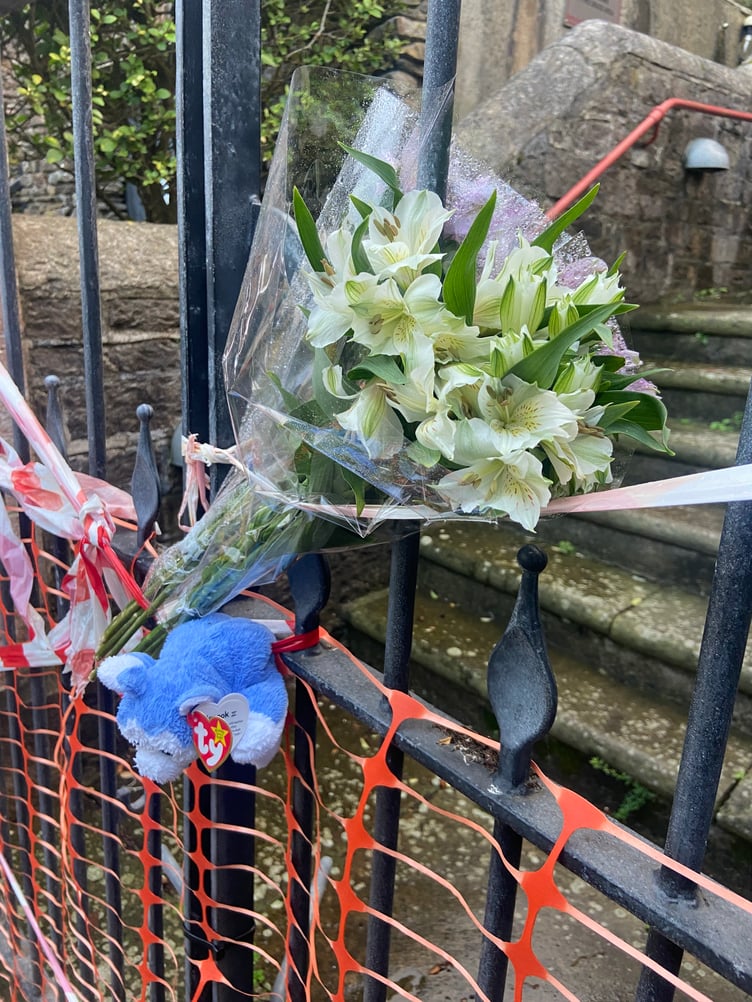 Tributes left outside St Barnabas Church for Rebecca Grass.